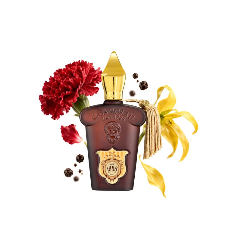 1888 by Xerjoff, bottle pictured with its key notes: Carnation, Pepper and Ylang-ylang