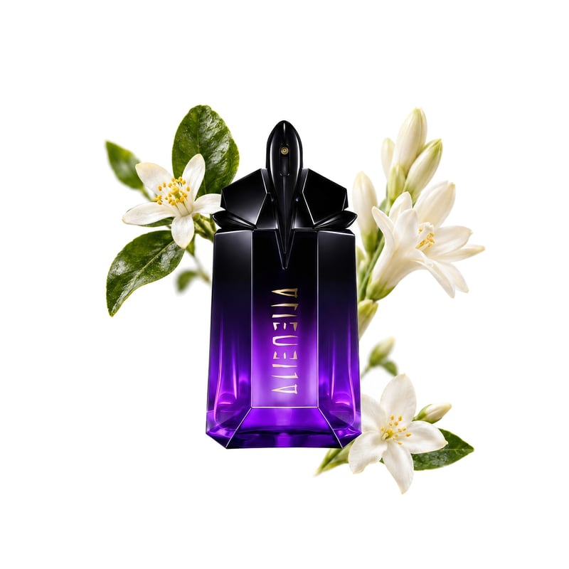 Alien Extraintense de Mugler, flacon entouré de ses notes clés : Petitgrain, Tubéreuse et Jasmin