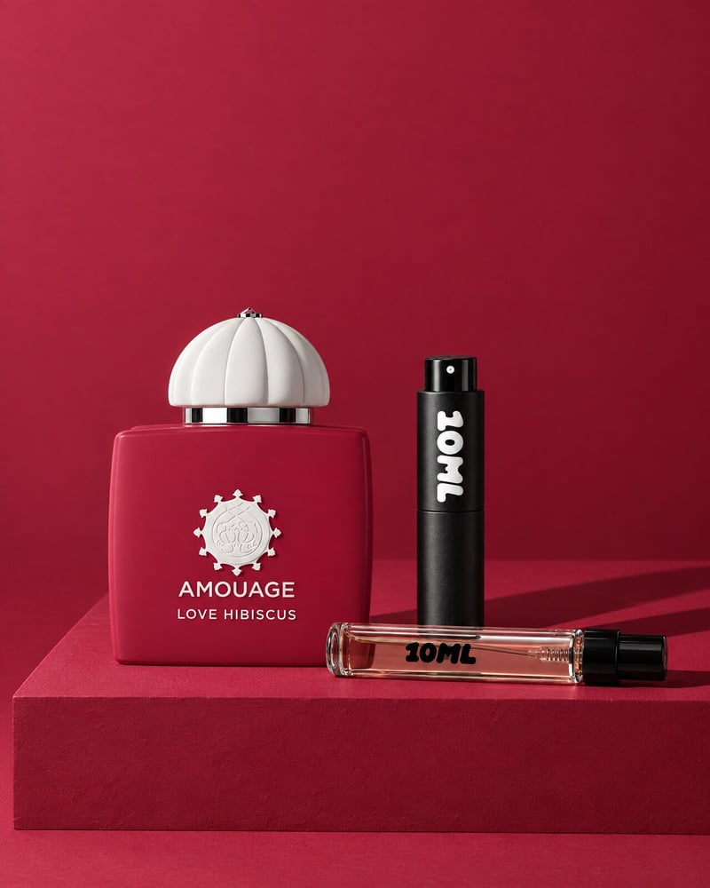Amouage Love Hibiscus with a 10ML travel atomiser and a 10ML refill vial on a red plinth