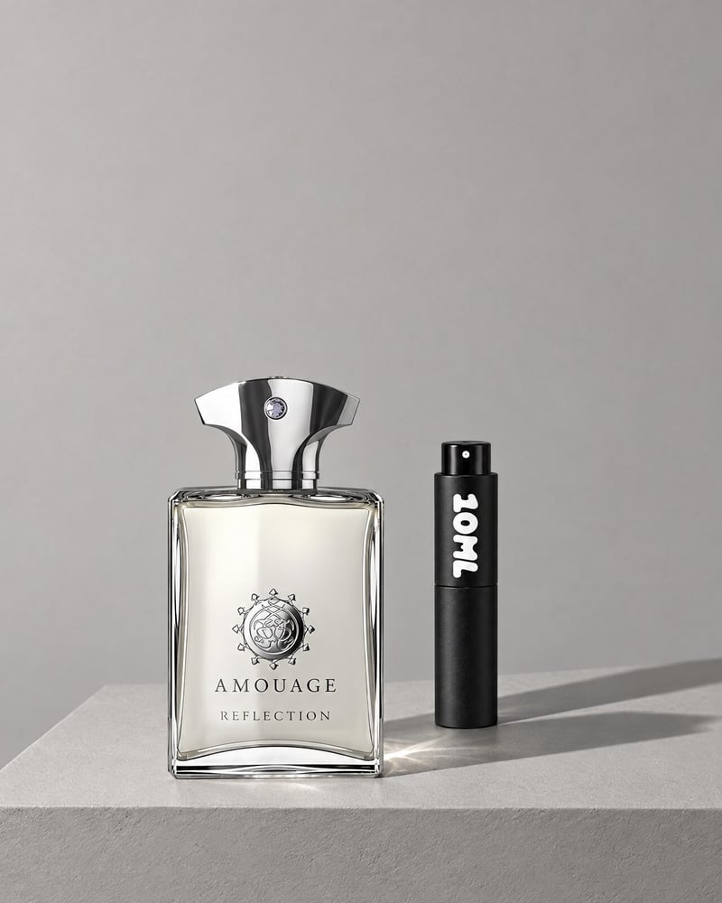 Amouage Reflection Man beside a 10ML travel atomiser on a grey plinth