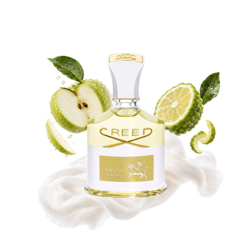 Aventus for Her by Creed, bottle pictured with its key notes: Green Apple, Bergamot and Musk