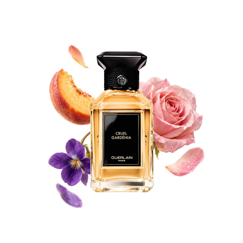 Cruel Gardénia by Guerlain, bottle pictured with its key notes: Peach, Rose and Violet