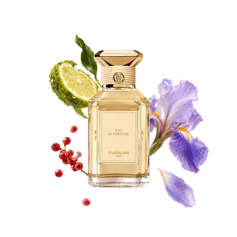 Eau de Popeline by Guerlain, bottle pictured with its key notes: Bergamot, Pink Pepper and Iris