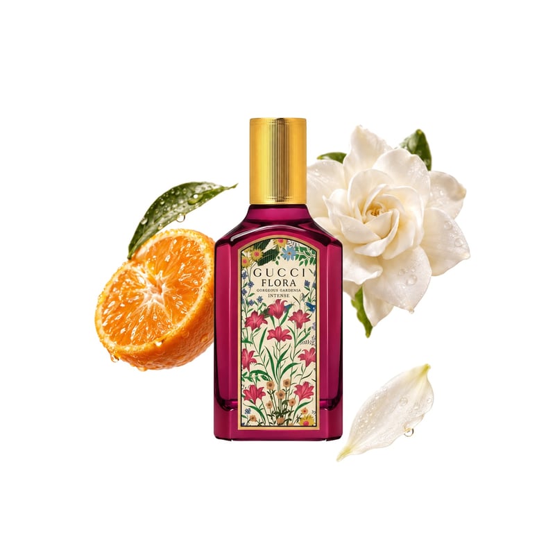Flora Gorgeous Gardenia Intense by Gucci, bottle pictured with its key notes: Mandarin Essence, Gardenia Accord and Hedione