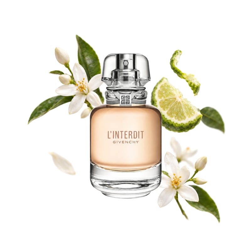 L'Interdit Eau de Toilette de Givenchy, flacon entouré de ses notes clés : Fleur d’oranger, Bergamote et Jasmin