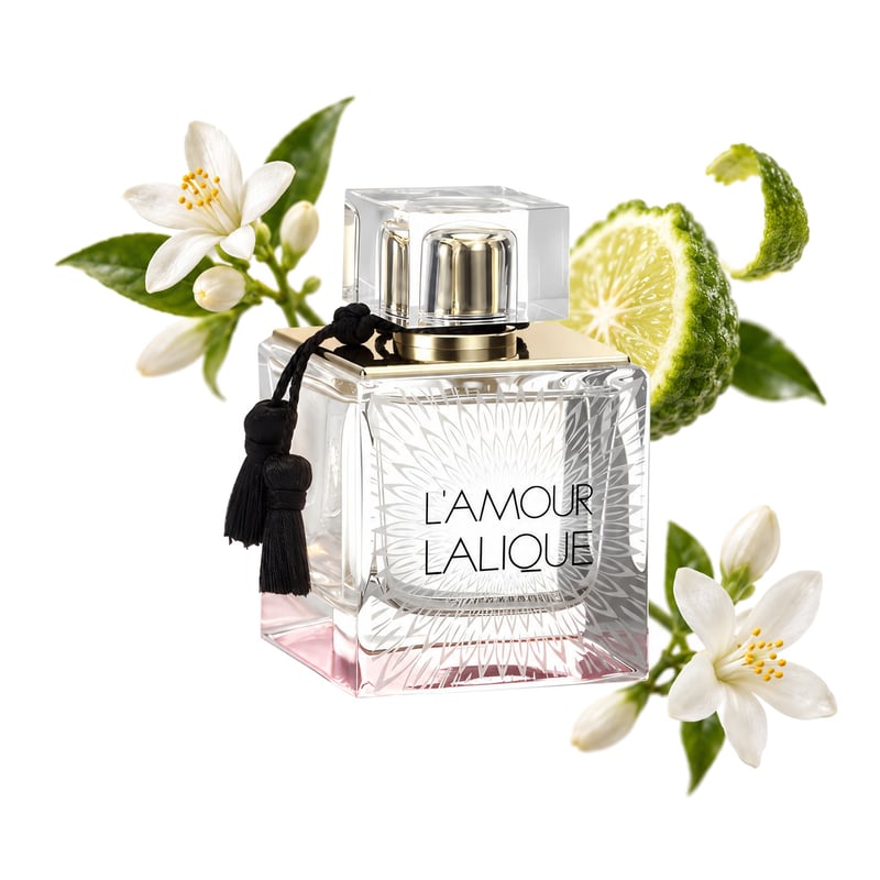 L'Amour by Lalique, bottle pictured with its key notes: Neroli, Bergamot and Jasmine