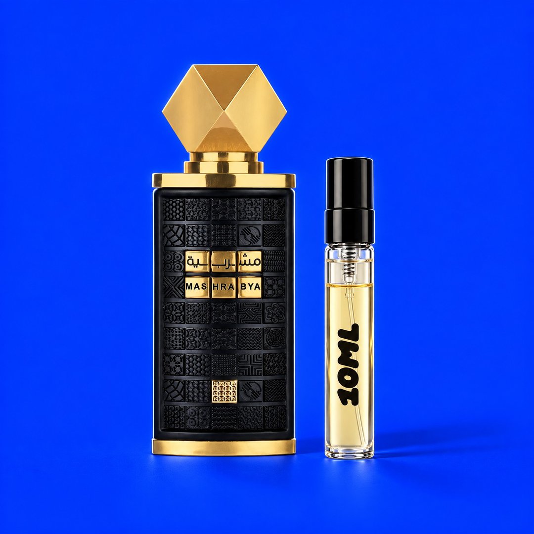 10 ml decant of Mashrabya by Lattafa next to the original bottle