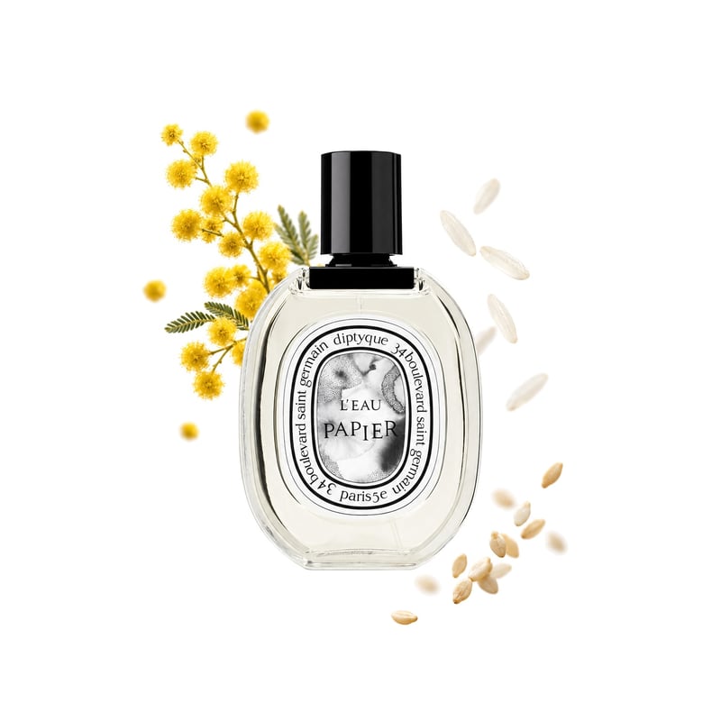 L'Eau Papier by Diptyque, bottle pictured with its key notes: Mimosa, Rice and Sesame