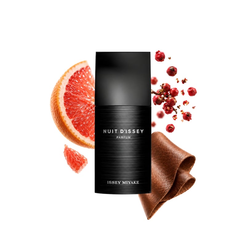 Nuit d’Issey Parfum by Issey Miyake, bottle pictured with its key notes: Grapefruit, Pink Pepper and Leather