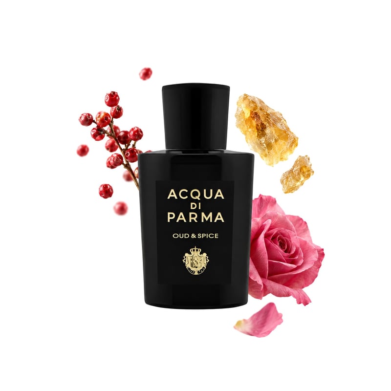 Oud & Spice by Acqua di Parma, bottle pictured with its key notes: Pink Pepper, Elemi and Rose