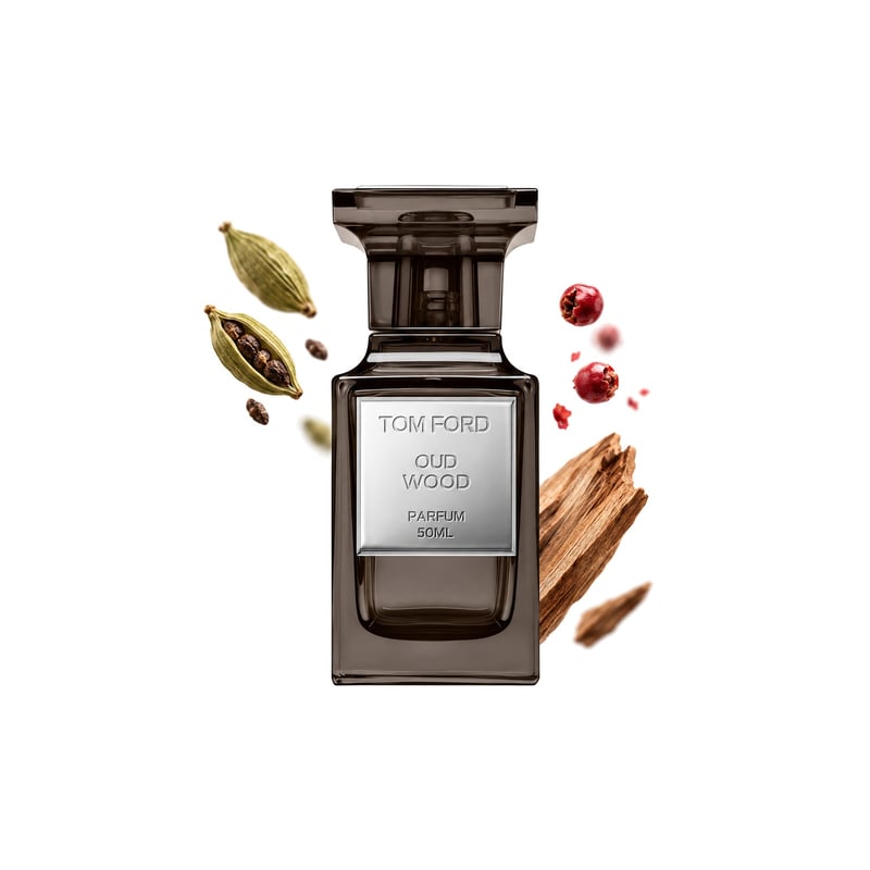 Oud Wood Parfum by Tom Ford, bottle pictured with its key notes: Cardamom, Pink Pepper and Sandalwood