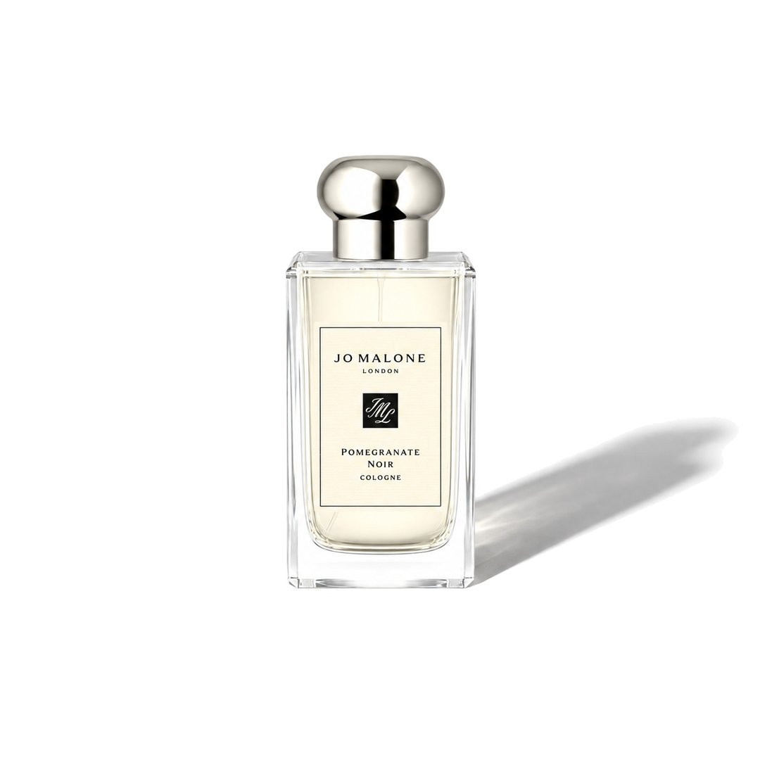 Pomegranate Noir by Jo Malone London, bottle casting a soft shadow, photo 1 of 6