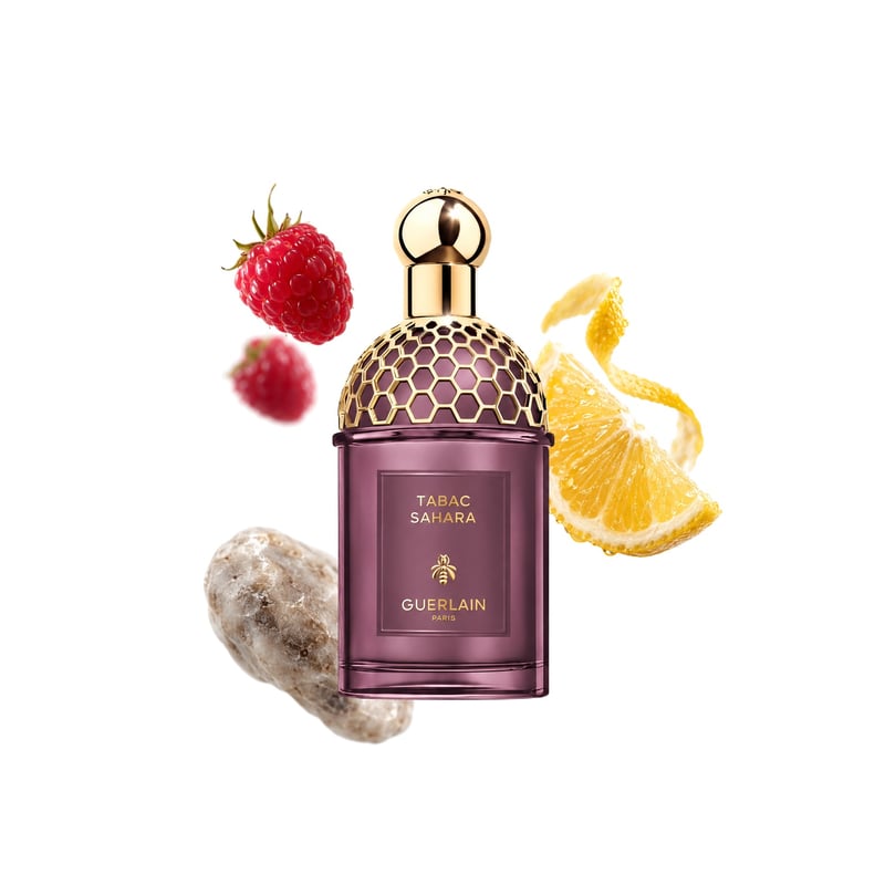 Tabac Sahara de Guerlain, flacon entouré de ses notes clés : Framboise, Agrumes et Ambre gris