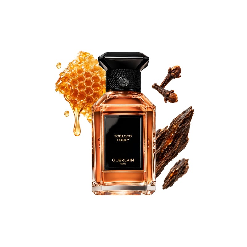 Tobacco Honey by Guerlain, bottle pictured with its key notes: Honey, Cloves and Agarwood (oud)
